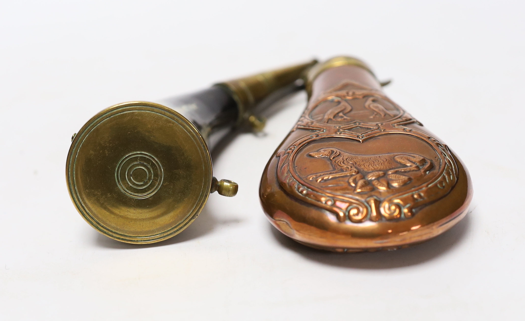 A brass mounted powder horn and a copper powder flask, horn 18cm